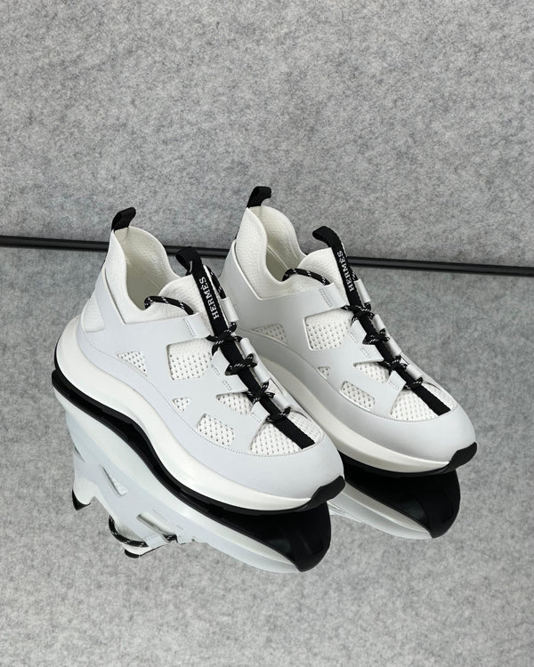Hermès Leader Sneaker in technical twill, calfskin, and suede goatskin.