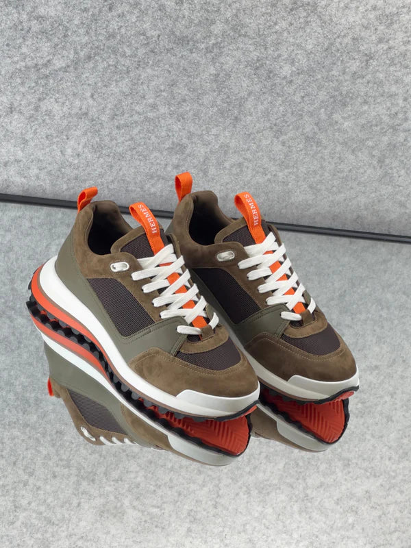 Hermès Leader Sneakers are crafted from a combination of technical twill, calfskin, and suede goatskin.