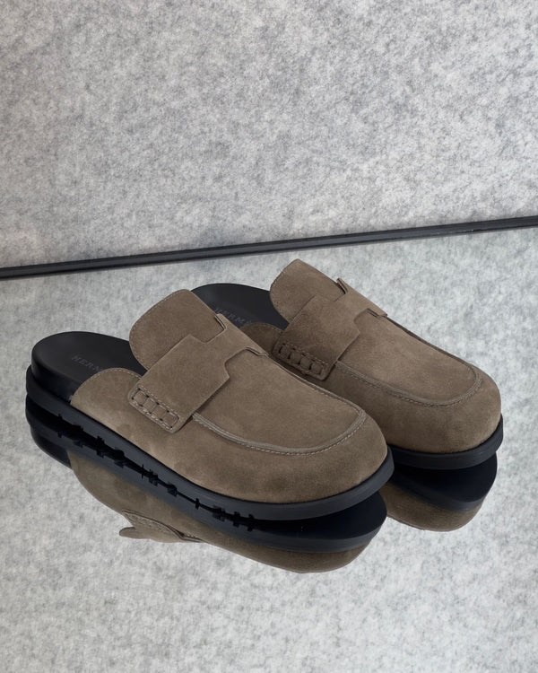 Hermès Go mules in brown suede.