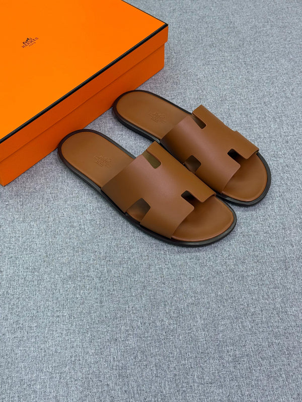 Hermès Izmir sandals for men, crafted in a warm brown "Gold" calfskin leather.