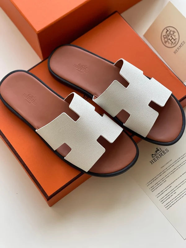 Hermès Izmir Sandal in white calfskin leather iconic "H" cutout.