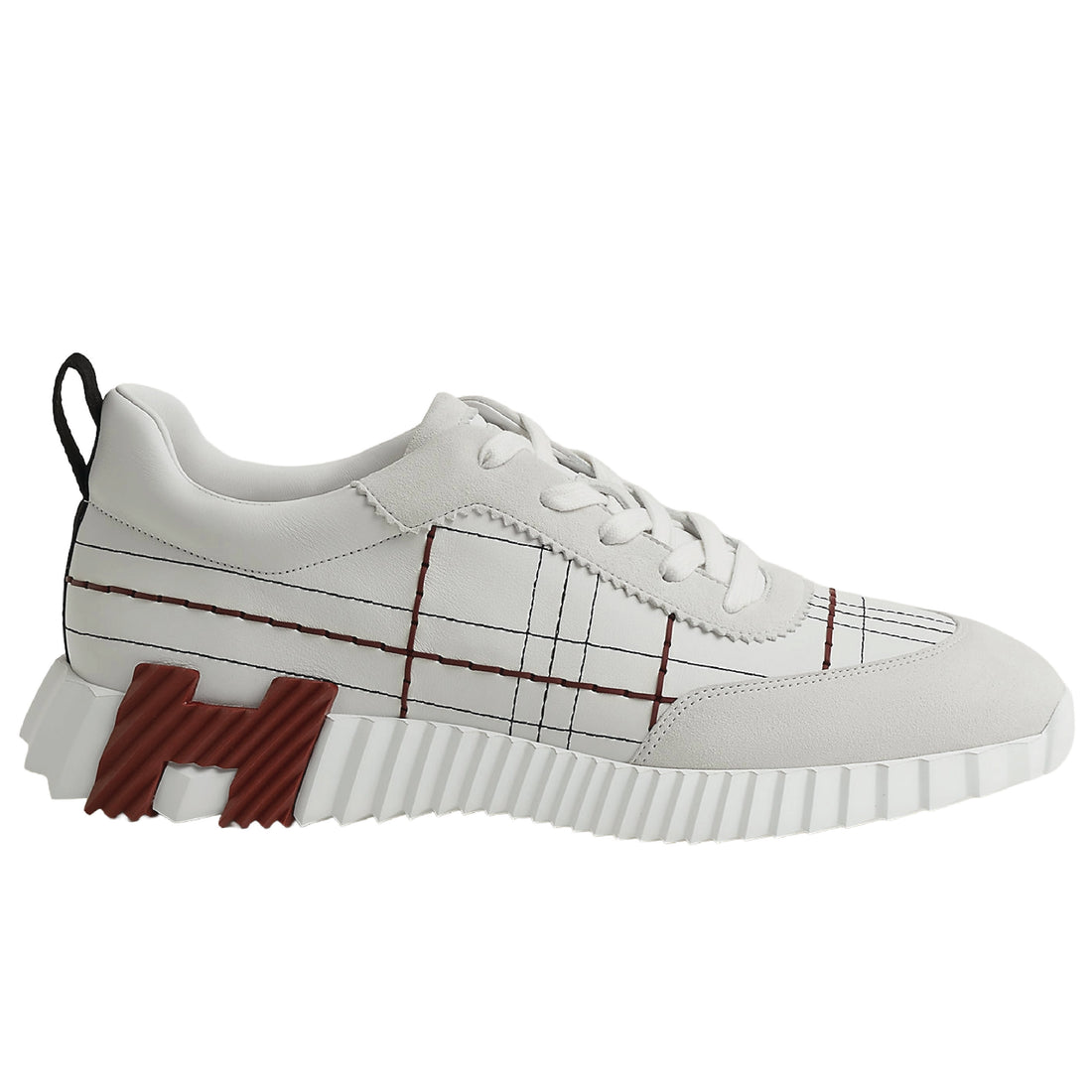 Hermès Bouncing sneakers are crafted from calfskin and suede goatskin, featuring a tartan-inspired motif
