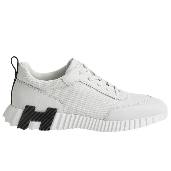 Hermès Bouncing sneaker, a luxury footwear option featuring a distinctive oversized "H" motif on the sole.